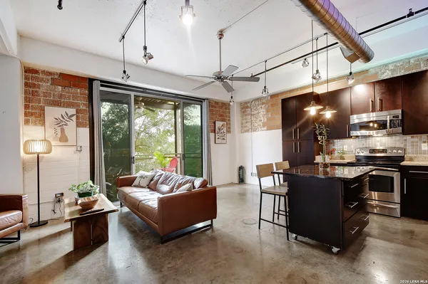 a kitchen with lots of counter space and appliances