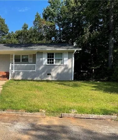 a house view with a garden space