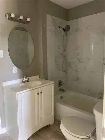 a bathroom with a sink a toilet and a bathtub