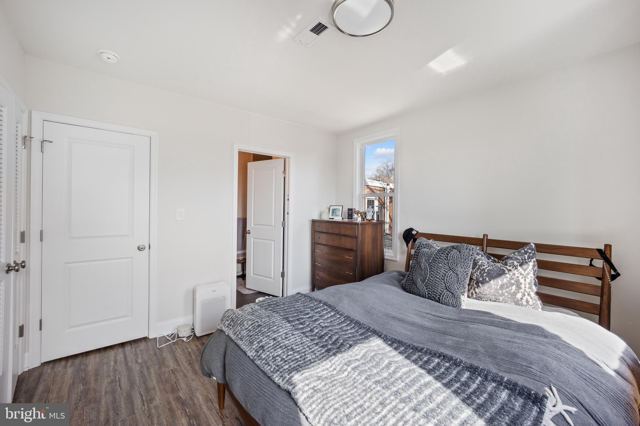 306 East Front Street Media, PA 19063 - Photo 8 of 10 a bedroom with a bed and wooden floor