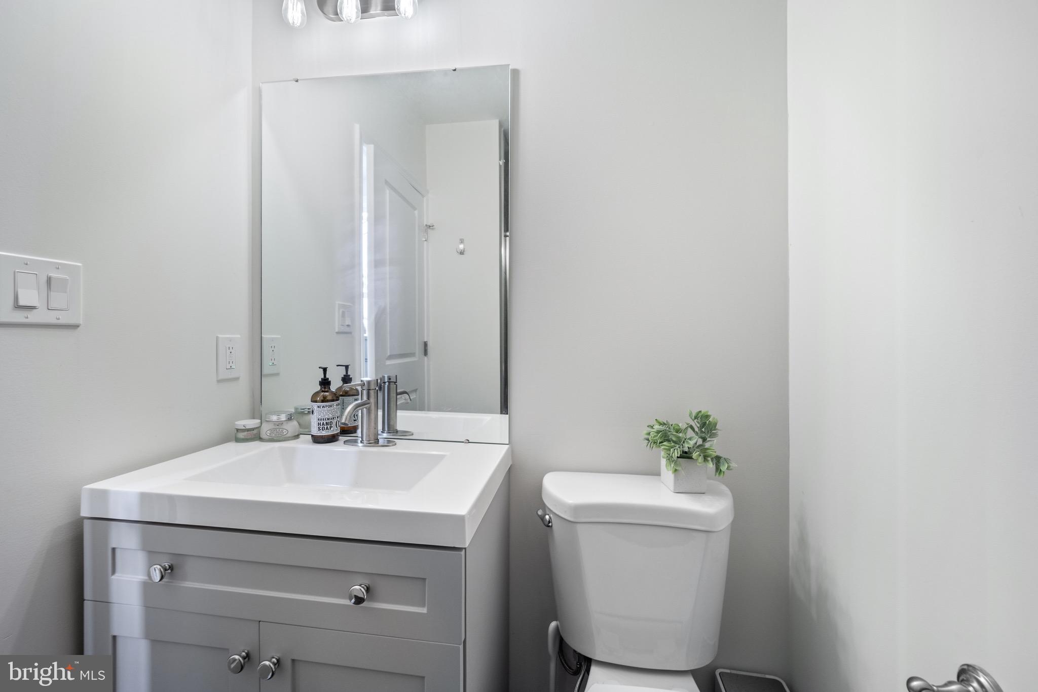 306 East Front Street Media, PA 19063 - Photo 9 of 10 a bathroom with a sink a toilet and a mirror