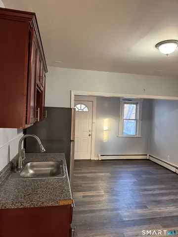 a view of a livingroom with wooden floor