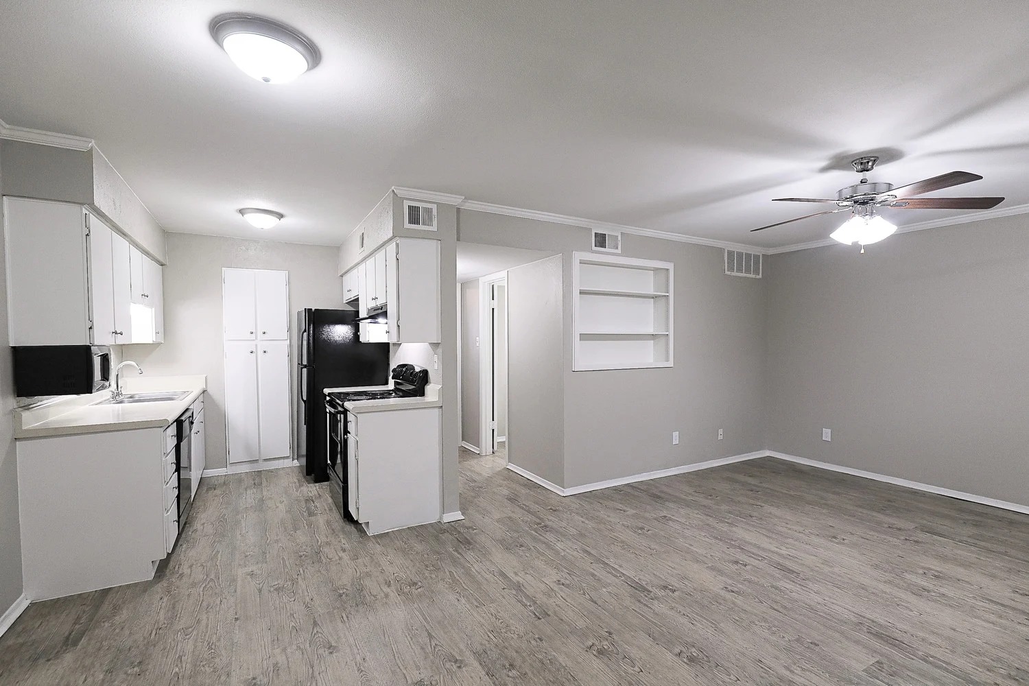 8100 North Mopac Expressway, Unit 2107 Austin, TX 78759 - Photo 13 of 23 Kitchen featuring built in shelves, white electric stove, white cabinetry, ceiling fan, and light countertops
