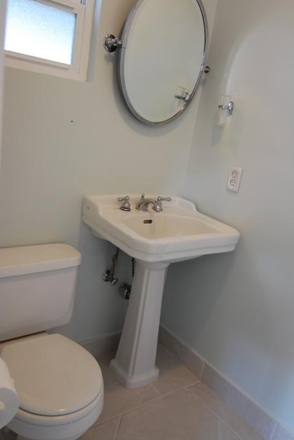200 North Rice Road Ojai, CA 93023 - Photo 15 of 21 a white toilet sitting next to a bathroom sink