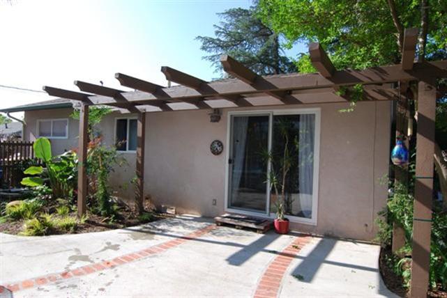 200 North Rice Road Ojai, CA 93023 - Photo 20 of 21 a view of a house with potted plants in front of it