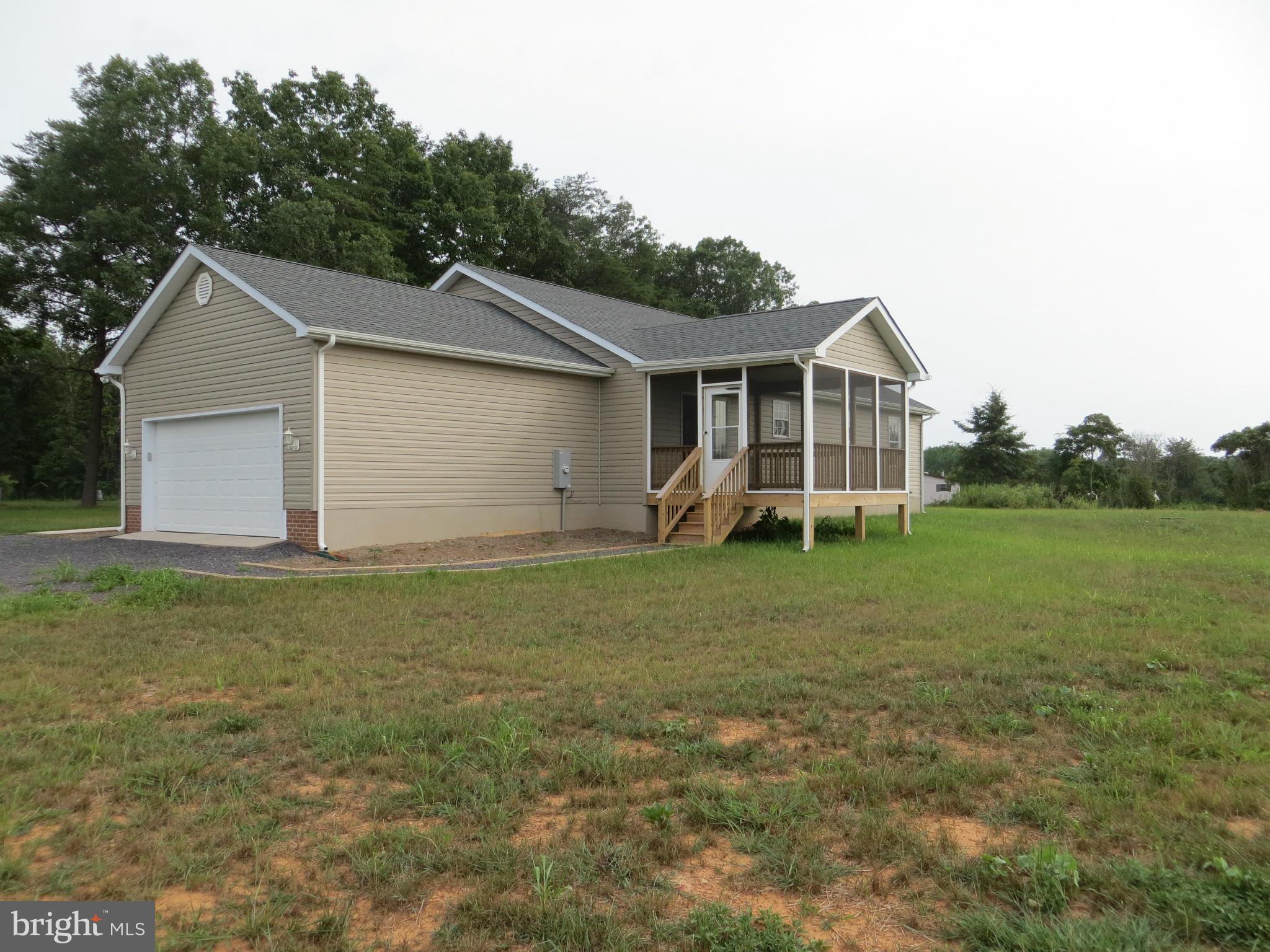 31253 Price Road Locust Grove, VA 22508 - Photo 2 of 24 Backyard towards garage & porch