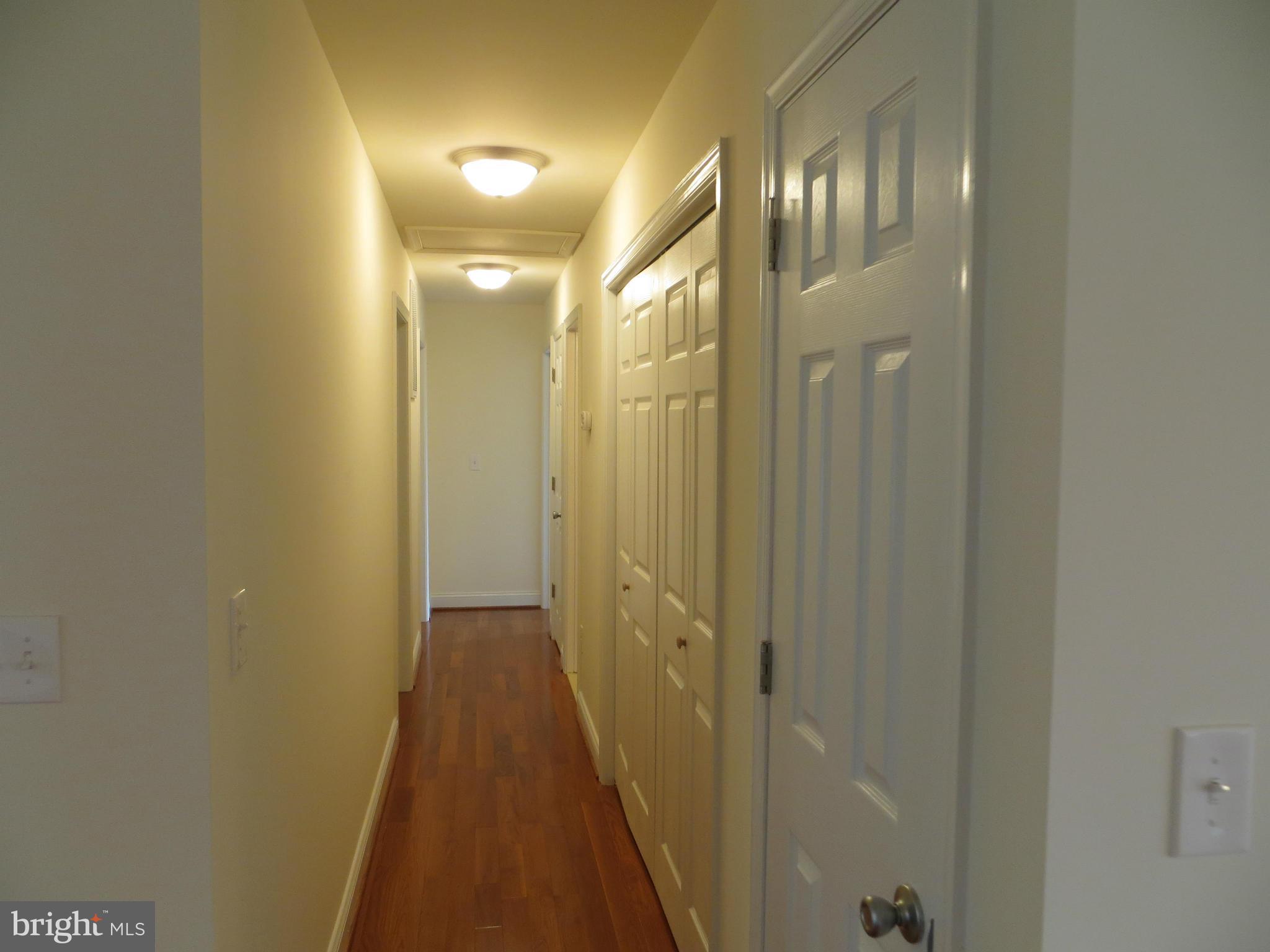 31253 Price Road Locust Grove, VA 22508 - Photo 11 of 24 Wood Hallway to BedRooms