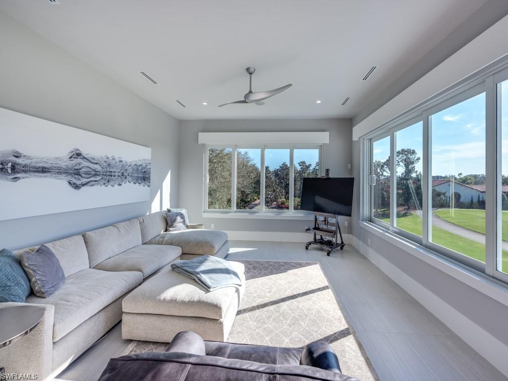 16892 Brightling Way Naples, FL 34110 - Photo 16 of 33 a living room with furniture and a large window