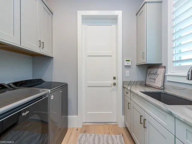 a kitchen with a sink and cabinets