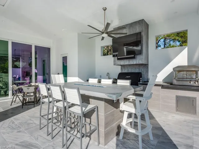 a kitchen with a table and chairs in it