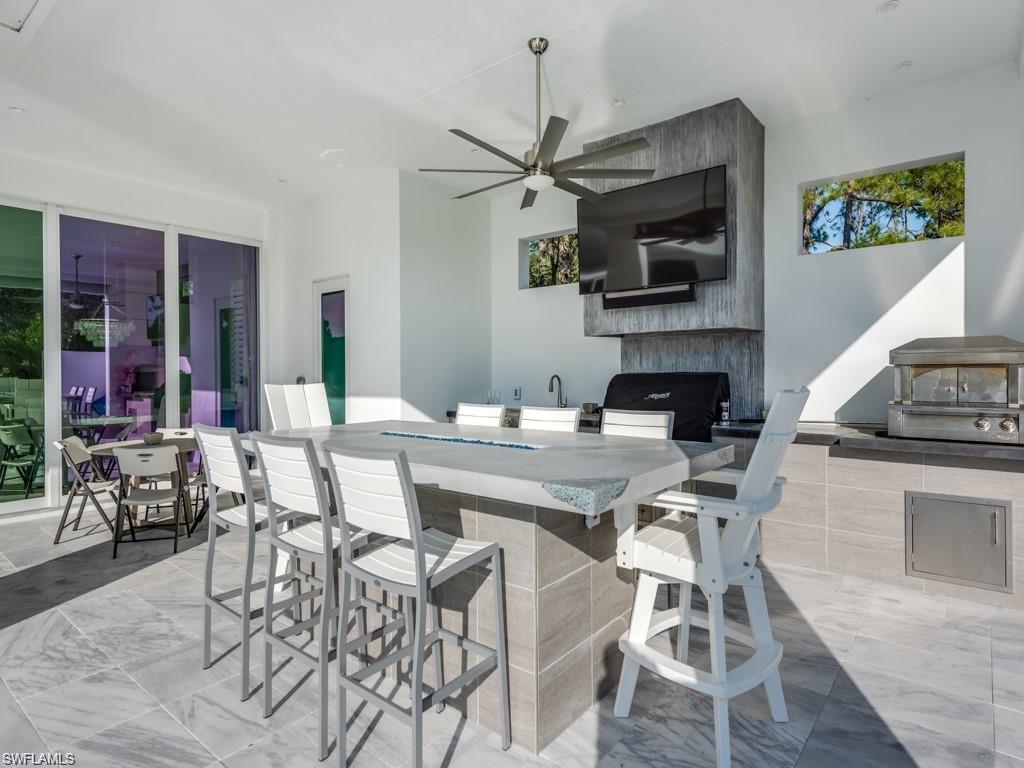 16892 Brightling Way Naples, FL 34110 - Photo 18 of 33 a kitchen with a table and chairs in it