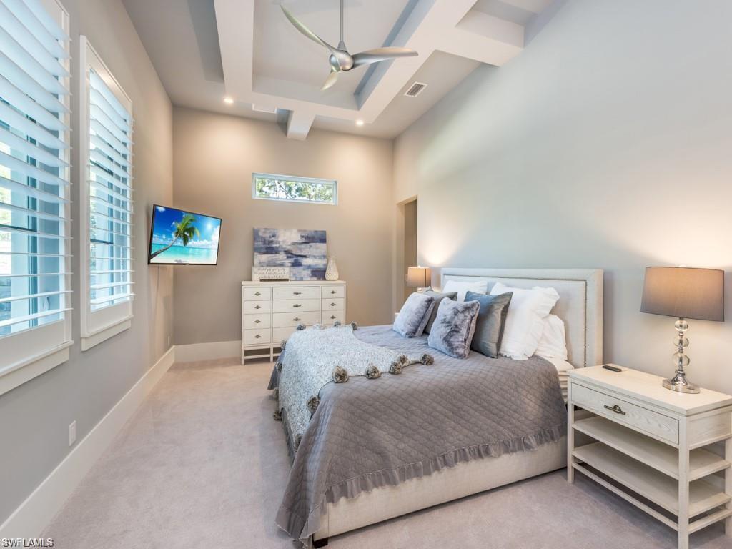 16892 Brightling Way Naples, FL 34110 - Photo 10 of 33 a bedroom with a bed and a large window