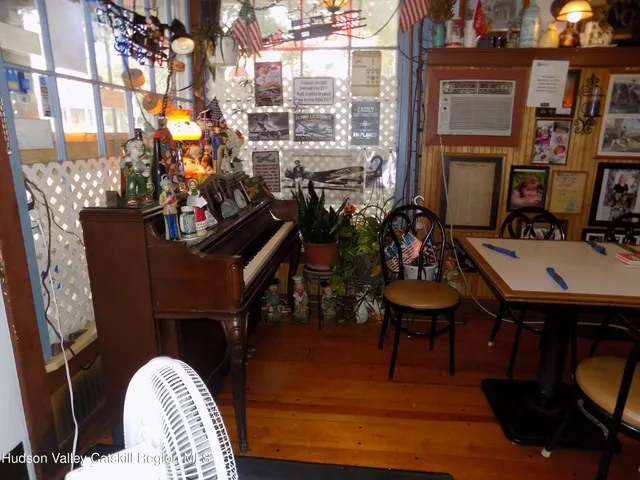 a view of a chairs and table in the balcony