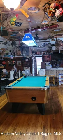 a view of a porch with wooden floor