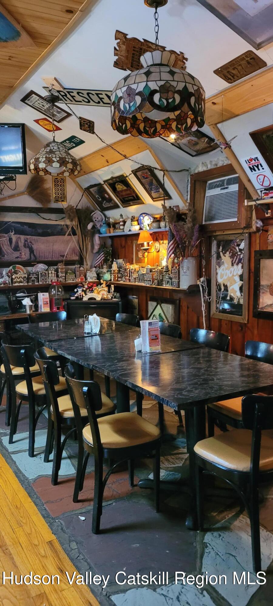3663 Rte 67 Freehold, NY 12431 - Photo 25 of 36 a view of a chairs and table in a patio
