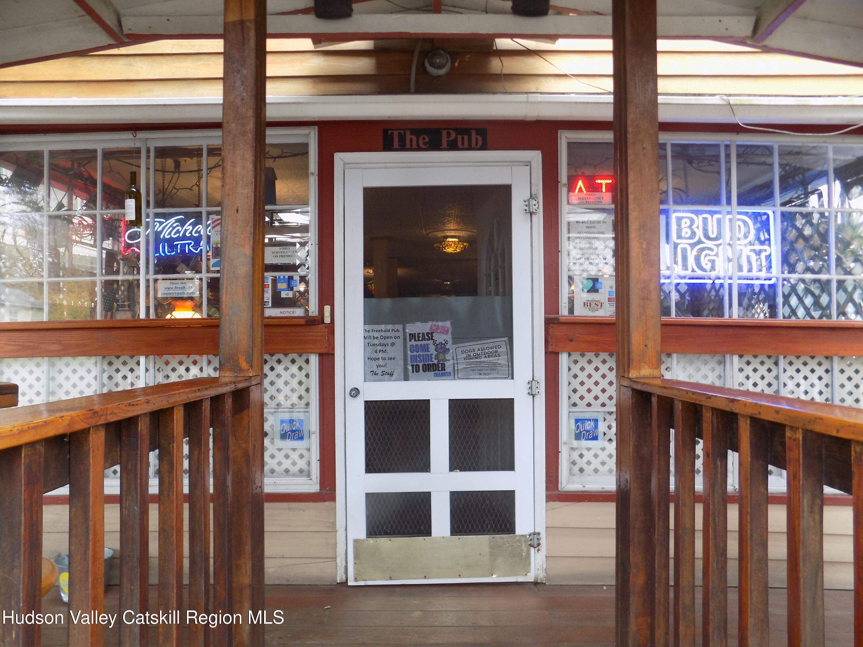 3663 Rte 67 Freehold, NY 12431 - Photo 33 of 36 a front view of a building with a glass door