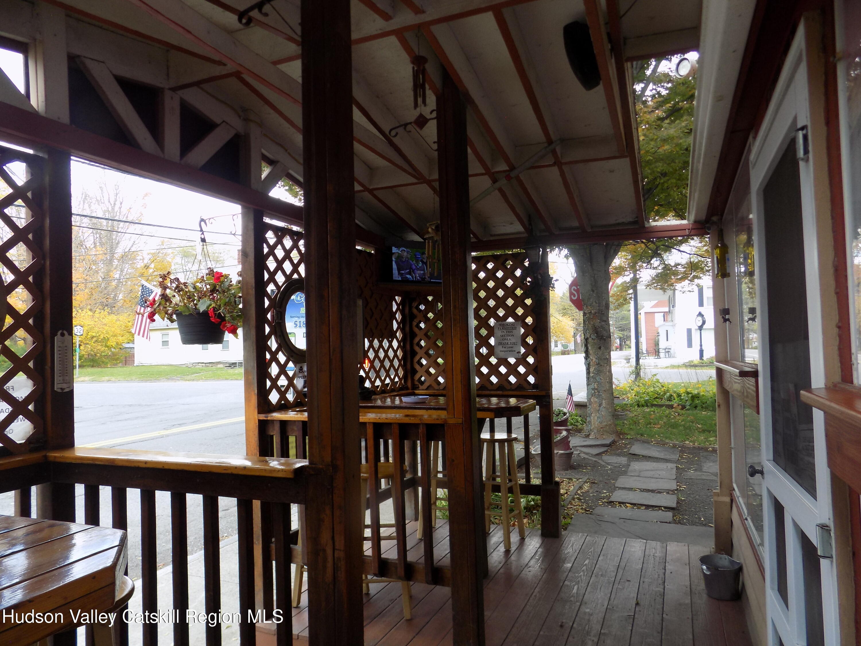 3663 Rte 67 Freehold, NY 12431 - Photo 36 of 36 a view of a porch with wooden floor