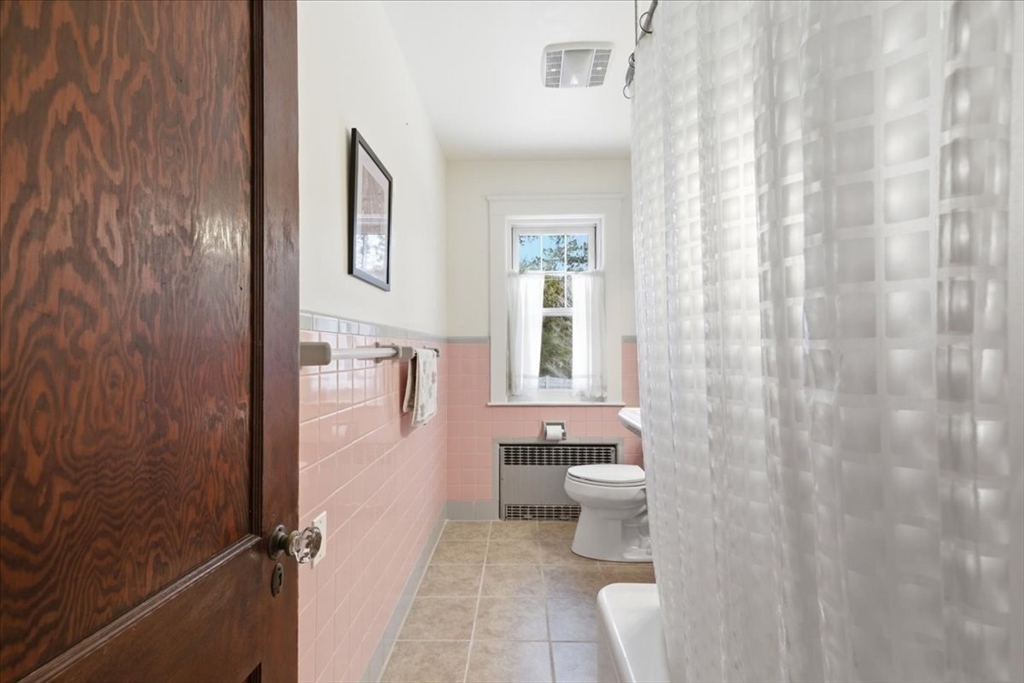 7 West Street Needham, MA 02494 - Photo 19 of 36 a bathroom with a toilet sink and a shower