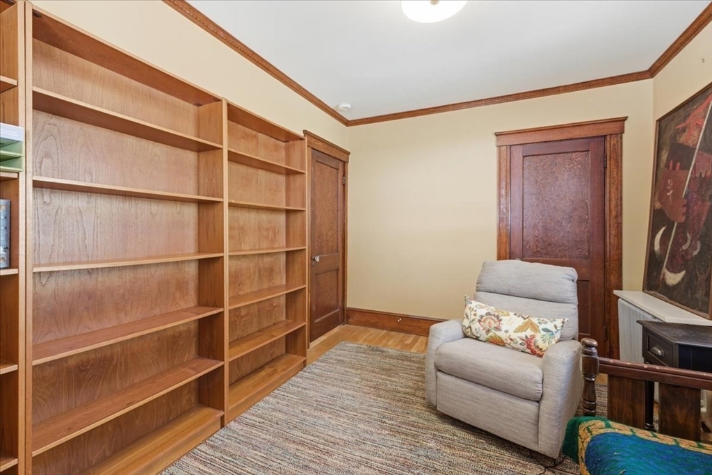 7 West Street Needham, MA 02494 - Photo 20 of 36 a living room with furniture and a flat screen tv