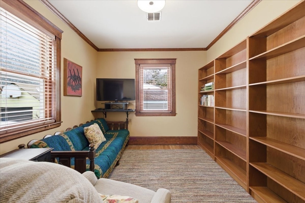 7 West Street Needham, MA 02494 - Photo 21 of 36 a living room with furniture a flat screen tv and a window