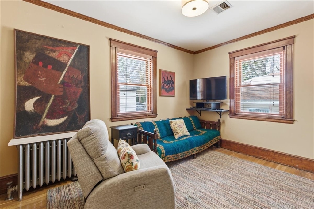 7 West Street Needham, MA 02494 - Photo 22 of 36 a living room with furniture and a window