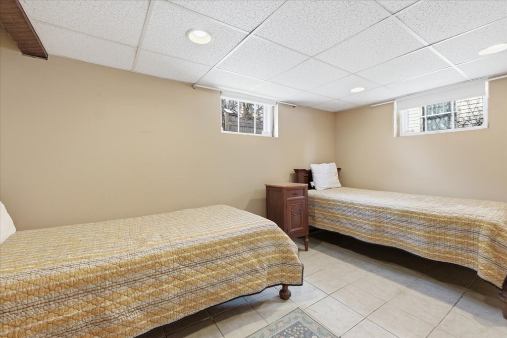 7 West Street Needham, MA 02494 - Photo 30 of 36 a bedroom with a bed and a window