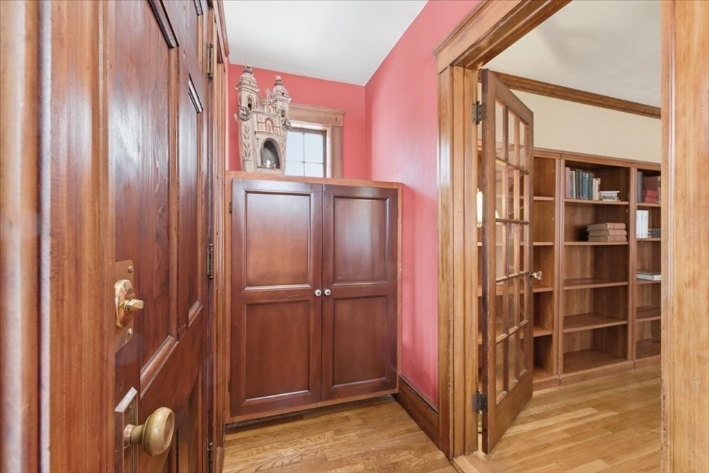 7 West Street Needham, MA 02494 - Photo 5 of 36 a view of a hallway with wooden shelves