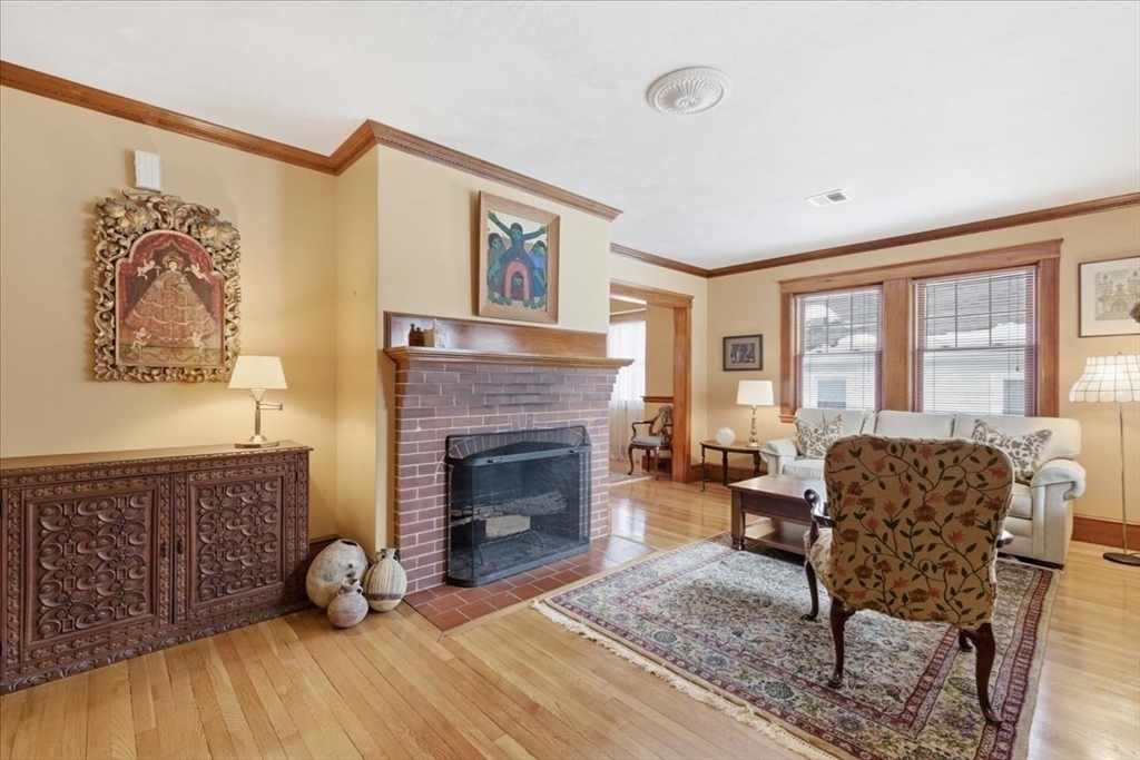 7 West Street Needham, MA 02494 - Photo 6 of 36 a living room with furniture and a fireplace