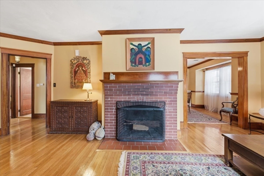 7 West Street Needham, MA 02494 - Photo 7 of 36 a living room with furniture and a fireplace
