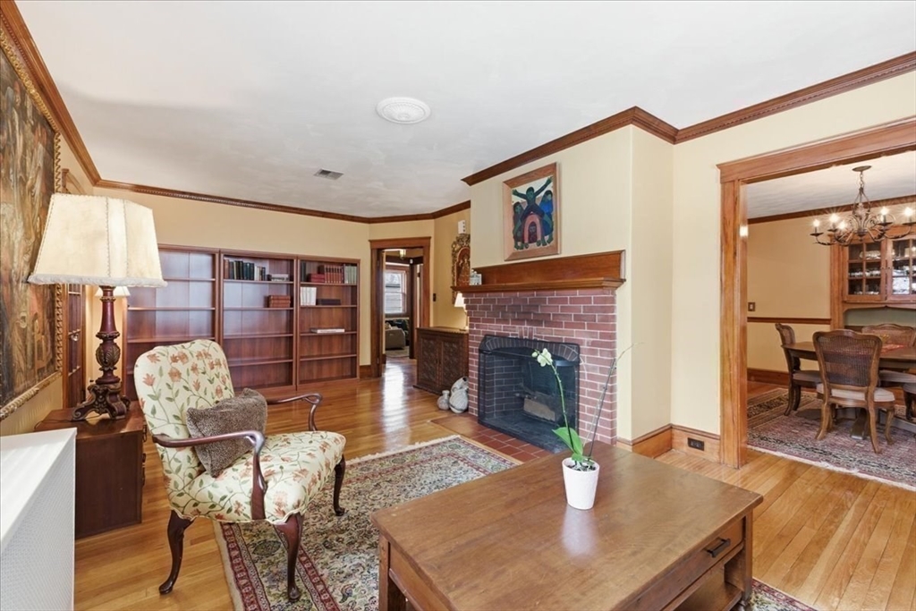 7 West Street Needham, MA 02494 - Photo 9 of 36 a living room with furniture a fireplace and a large window