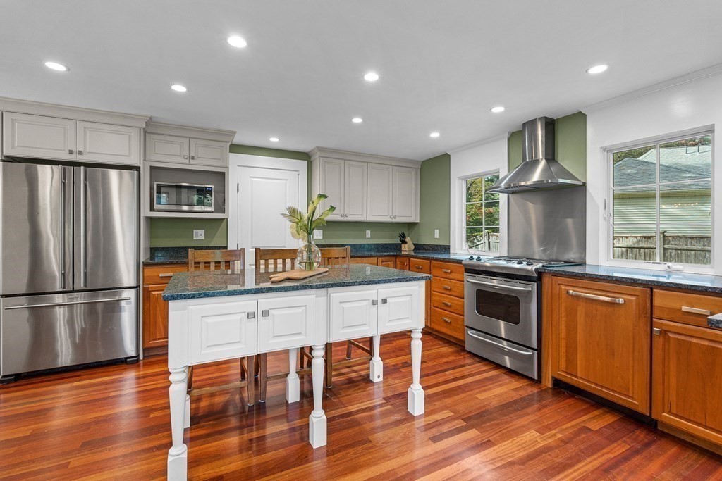 98 Parker Road Wellesley, MA 02482 - Photo 12 of 30 a kitchen with granite countertop stainless steel appliances a refrigerator and wooden floor