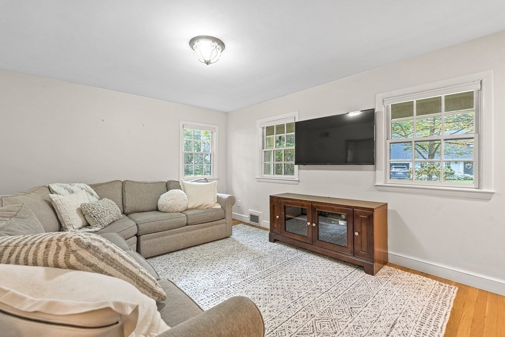 98 Parker Road Wellesley, MA 02482 - Photo 14 of 30 a living room with furniture a flat screen tv and a fireplace