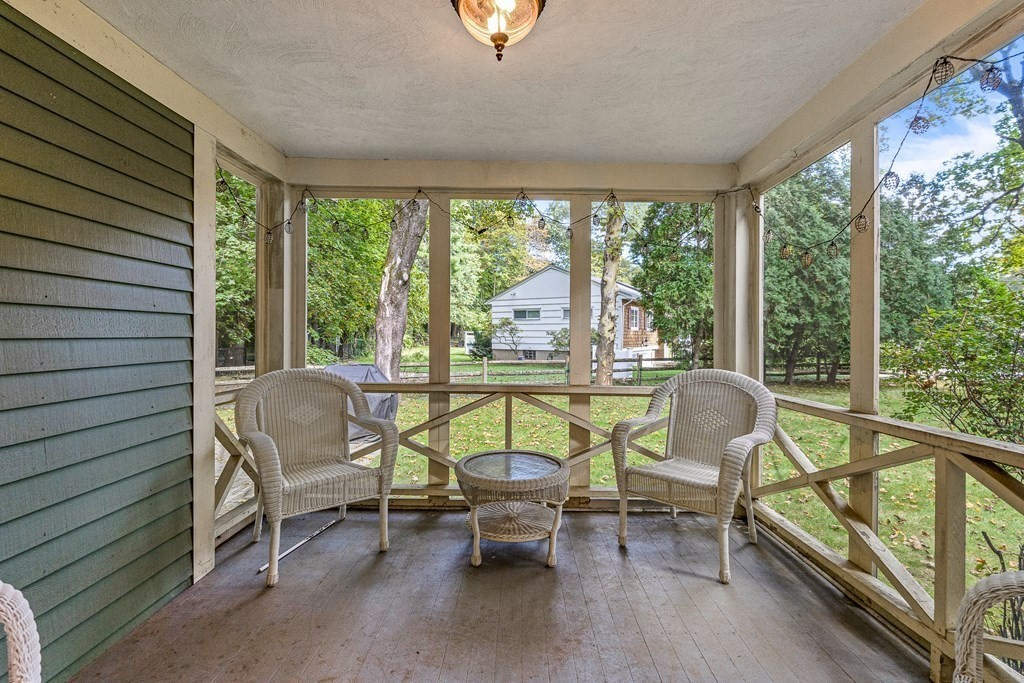 98 Parker Road Wellesley, MA 02482 - Photo 16 of 30 a living room with furniture and a floor to ceiling window