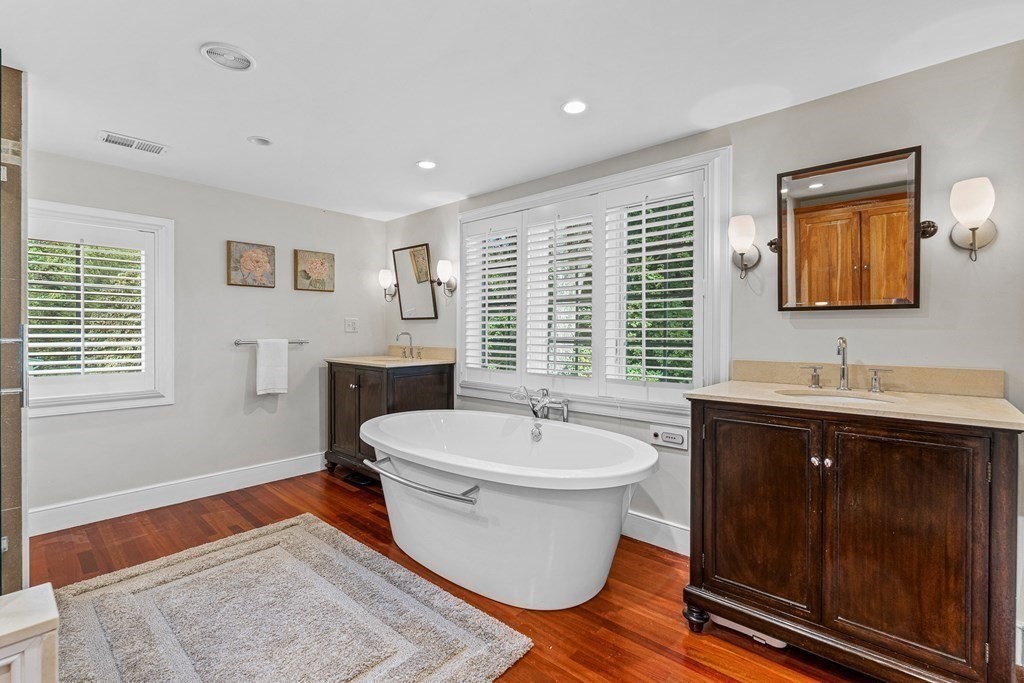 98 Parker Road Wellesley, MA 02482 - Photo 21 of 30 a spacious bathroom with a double vanity sink a mirror and a bathtub
