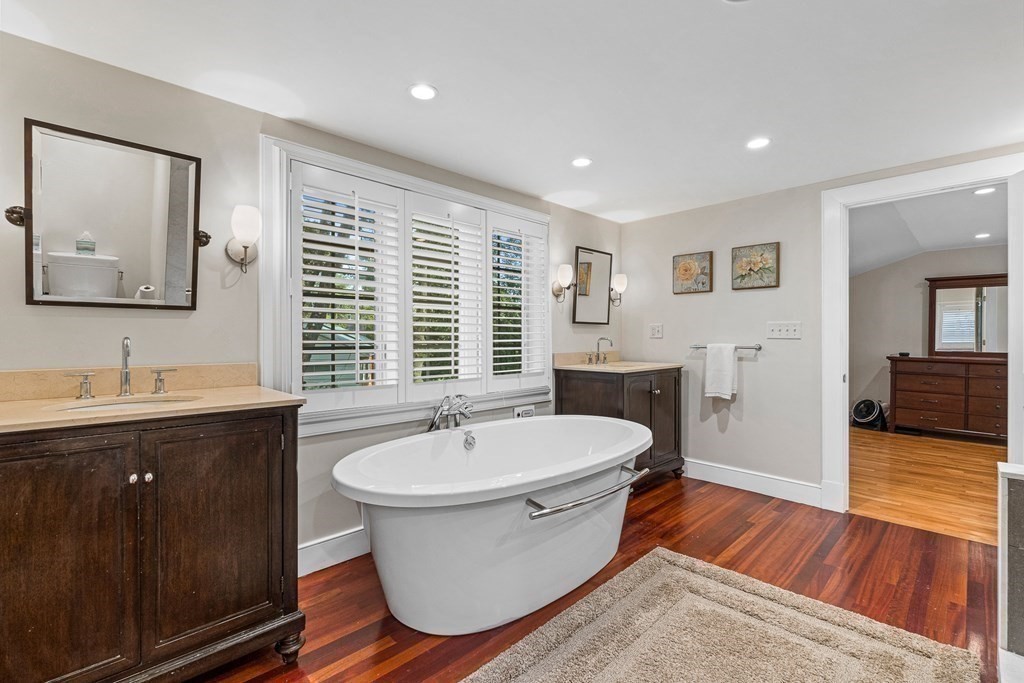 98 Parker Road Wellesley, MA 02482 - Photo 23 of 30 a spacious bathroom with a double vanity sink a mirror and a bathtub