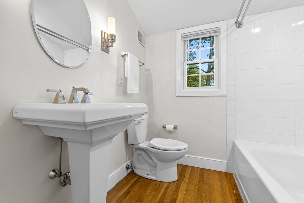 98 Parker Road Wellesley, MA 02482 - Photo 26 of 30 a bathroom with a sink and a mirror