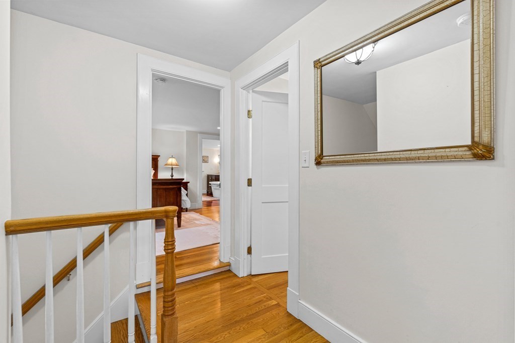 98 Parker Road Wellesley, MA 02482 - Photo 27 of 30 a view of a hallway with wooden floor and staircase