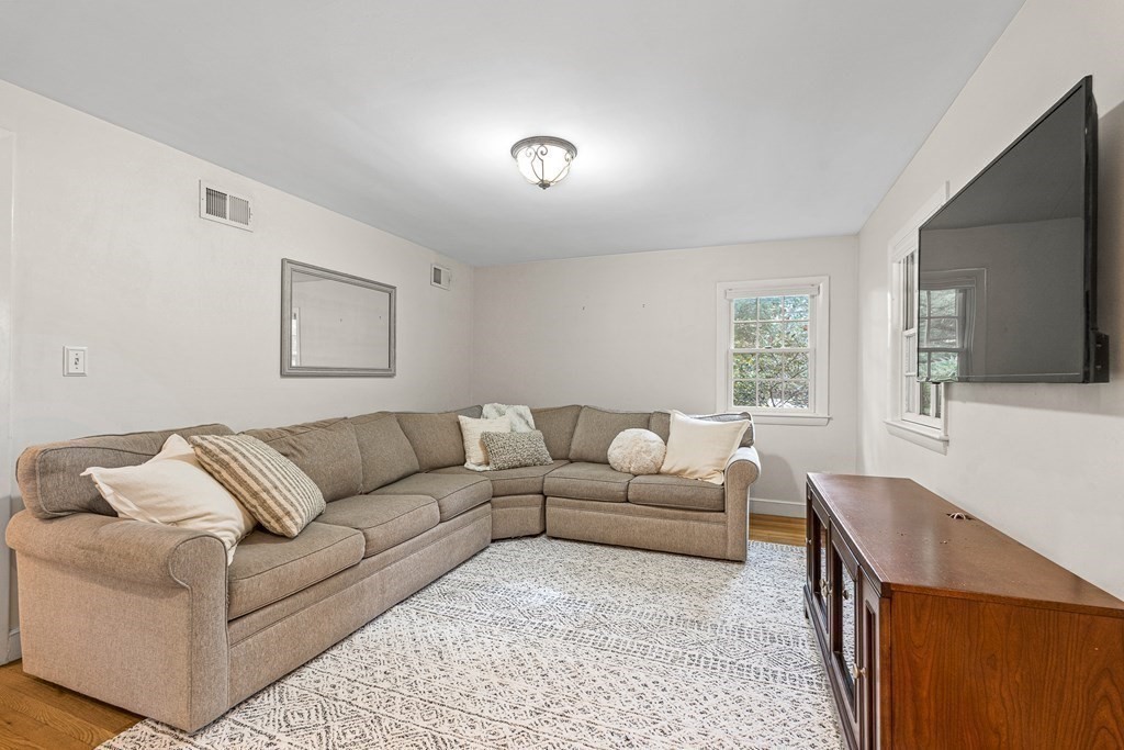 98 Parker Road Wellesley, MA 02482 - Photo 8 of 30 a living room with furniture and a flat screen tv