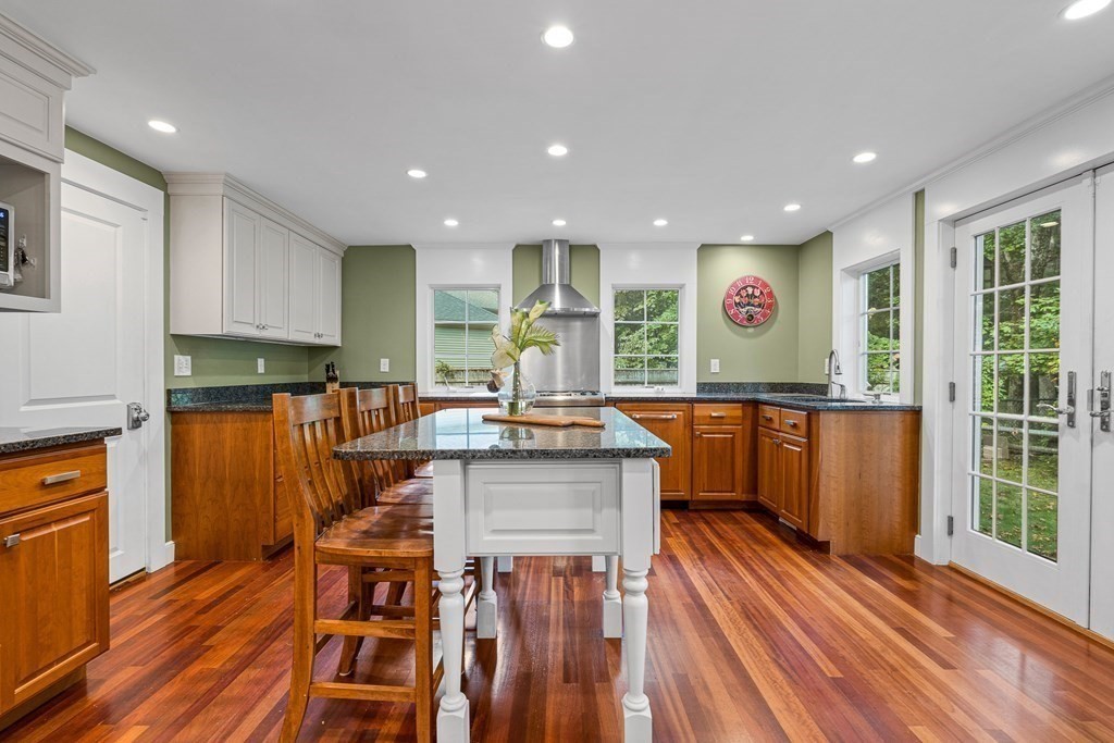 98 Parker Road Wellesley, MA 02482 - Photo 10 of 30 a kitchen with stainless steel appliances granite countertop a stove top oven a sink and a refrigerator