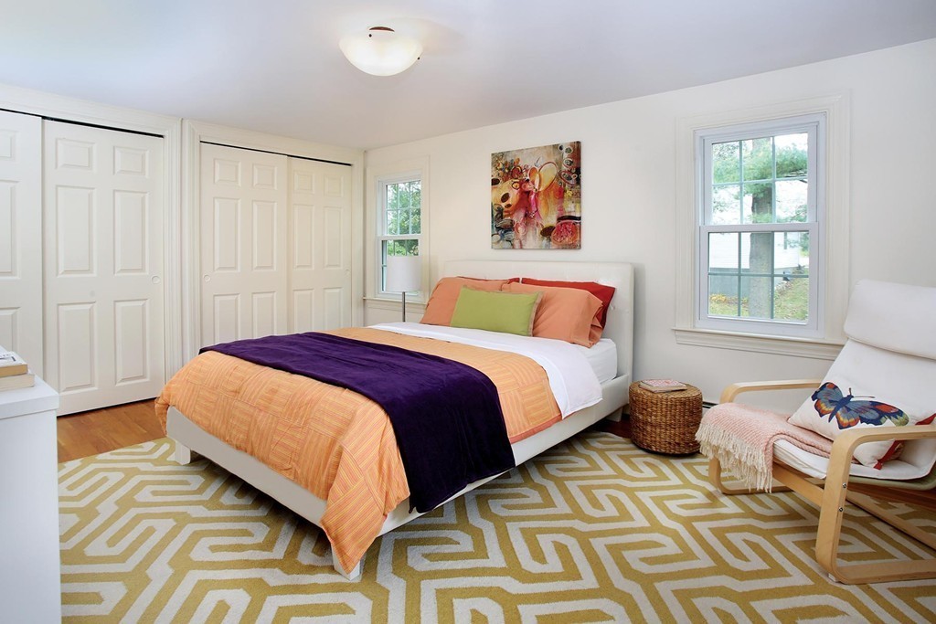 29 Parker Road Needham, MA 02494 - Photo 12 of 14 a bedroom with a bed and wooden floor