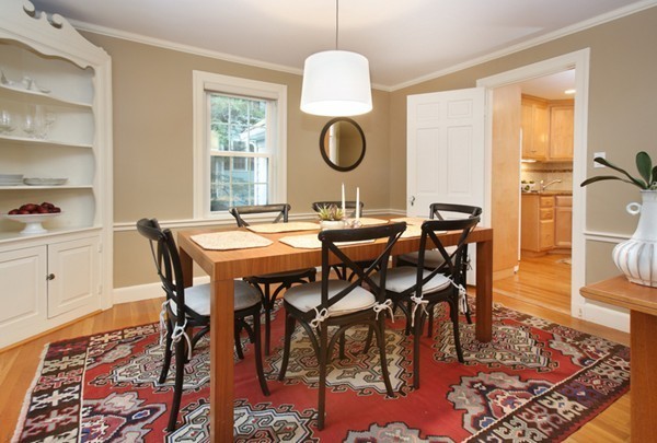 29 Parker Road Needham, MA 02494 - Photo 6 of 14 a dining room with wooden floor a chandelier a wooden table and chairs