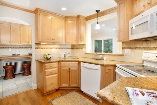 29 Parker Road Needham, MA 02494 - Photo 7 of 14 a kitchen with a sink stove and cabinets
