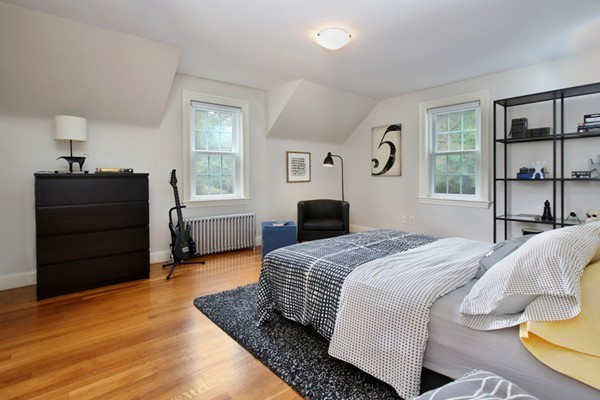 29 Parker Road Needham, MA 02494 - Photo 9 of 14 a bedroom with a bed and wooden floor