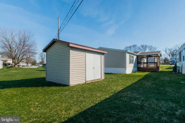 a view of balcony with wooden floor