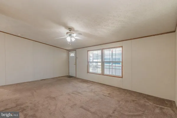 a view of a hallway with seating area