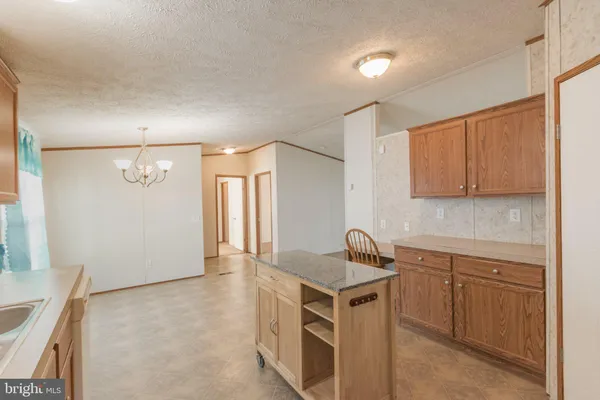 a view of a livingroom with furniture and chandelier