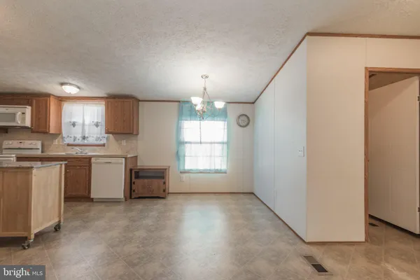 a kitchen with a sink and a refrigerator