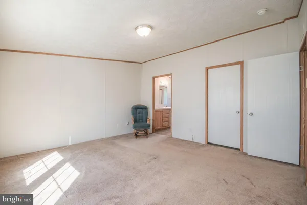 a white bath tub sitting in a bathroom next to a window