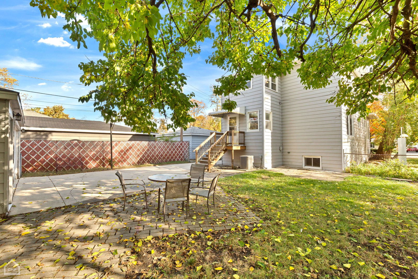 30 North Delaplaine Road Riverside, IL 60546 - Photo 19 of 21 a view of a patio with table and chairs and floor to ceiling window