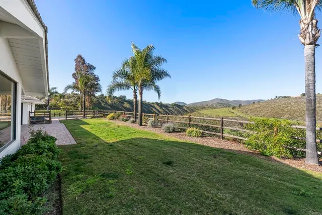 a view of a garden with a building in the background